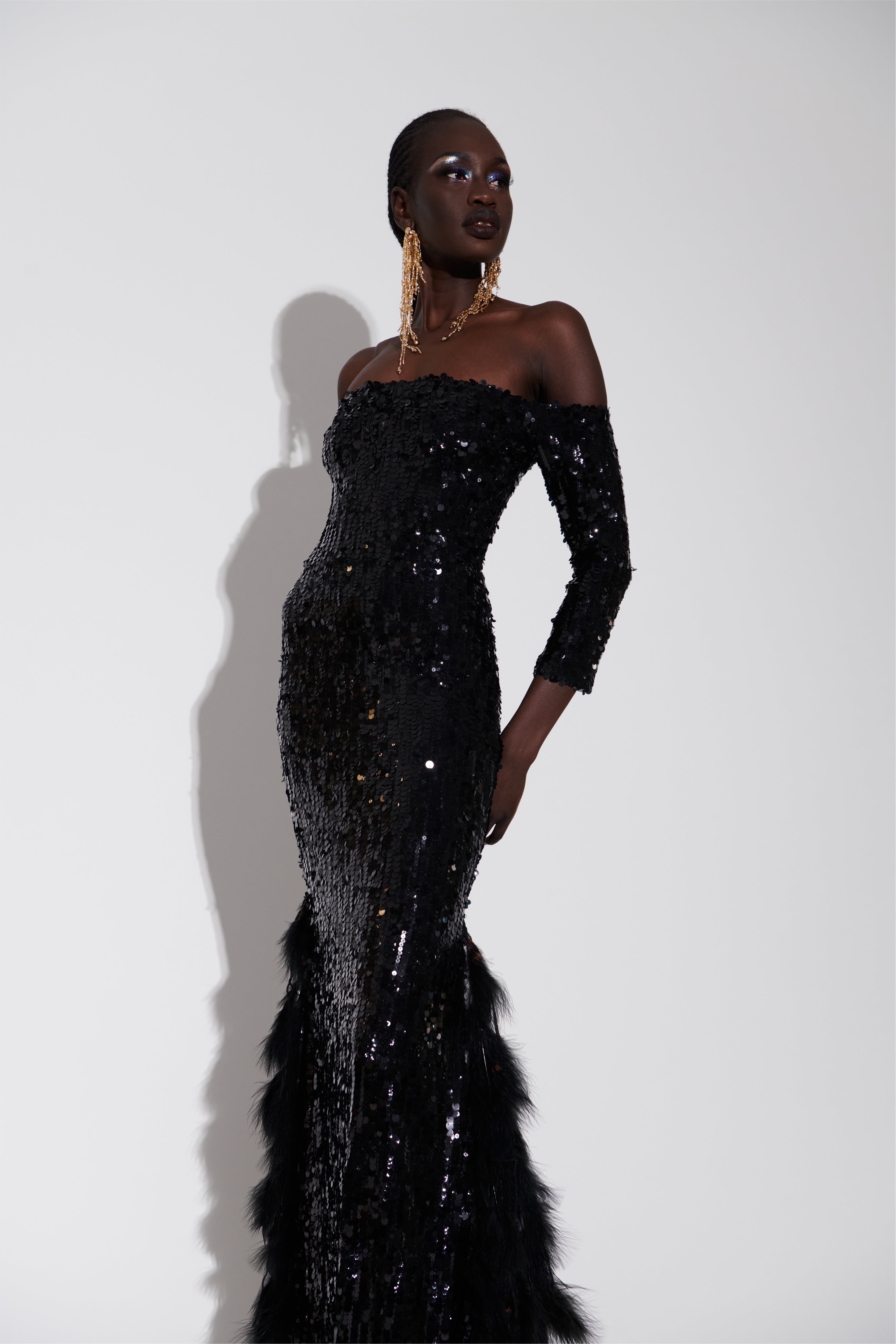 FEATHERED BLACK SEQUIN GOWN