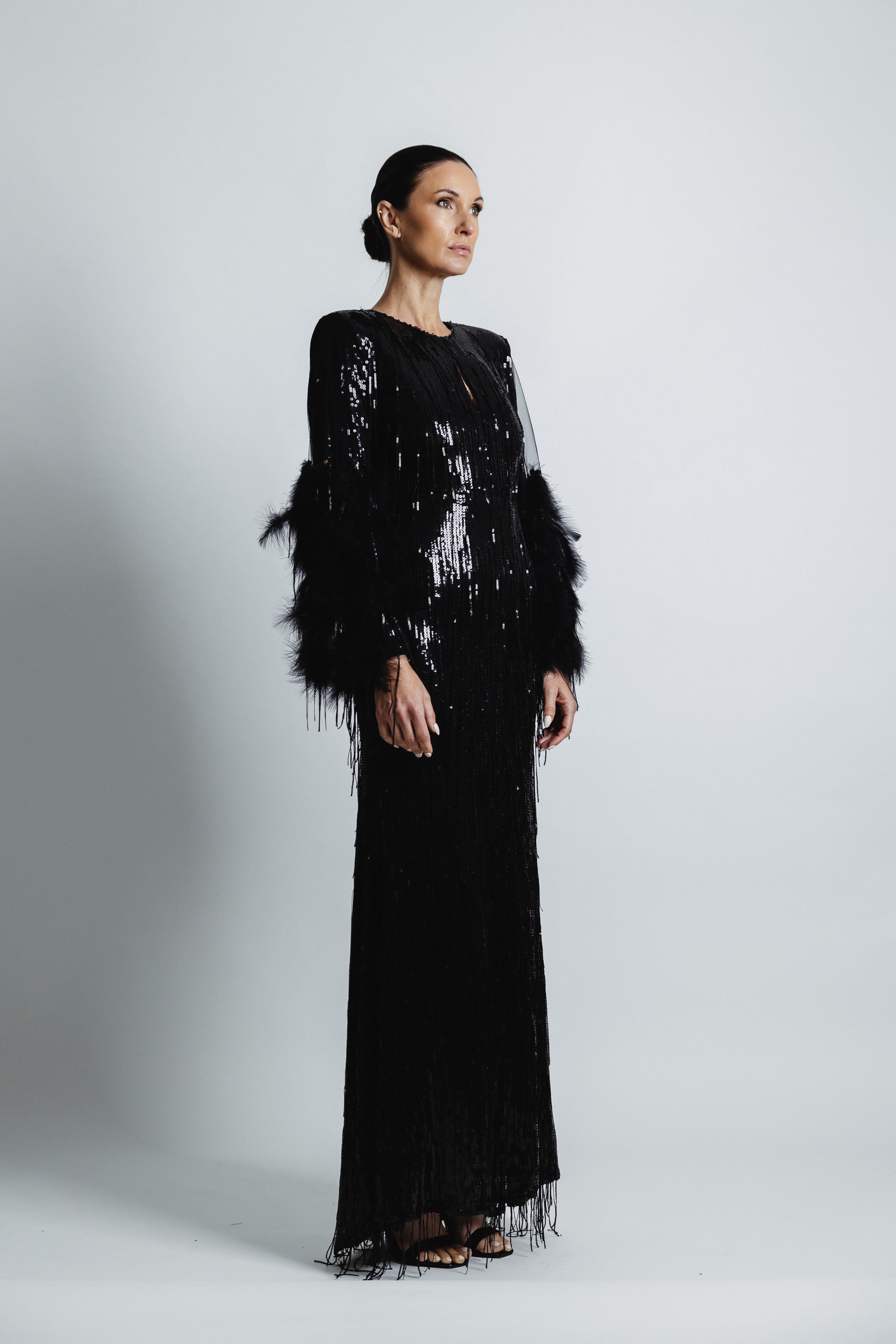 FEATHERED BLACK SEQUIN GOWN