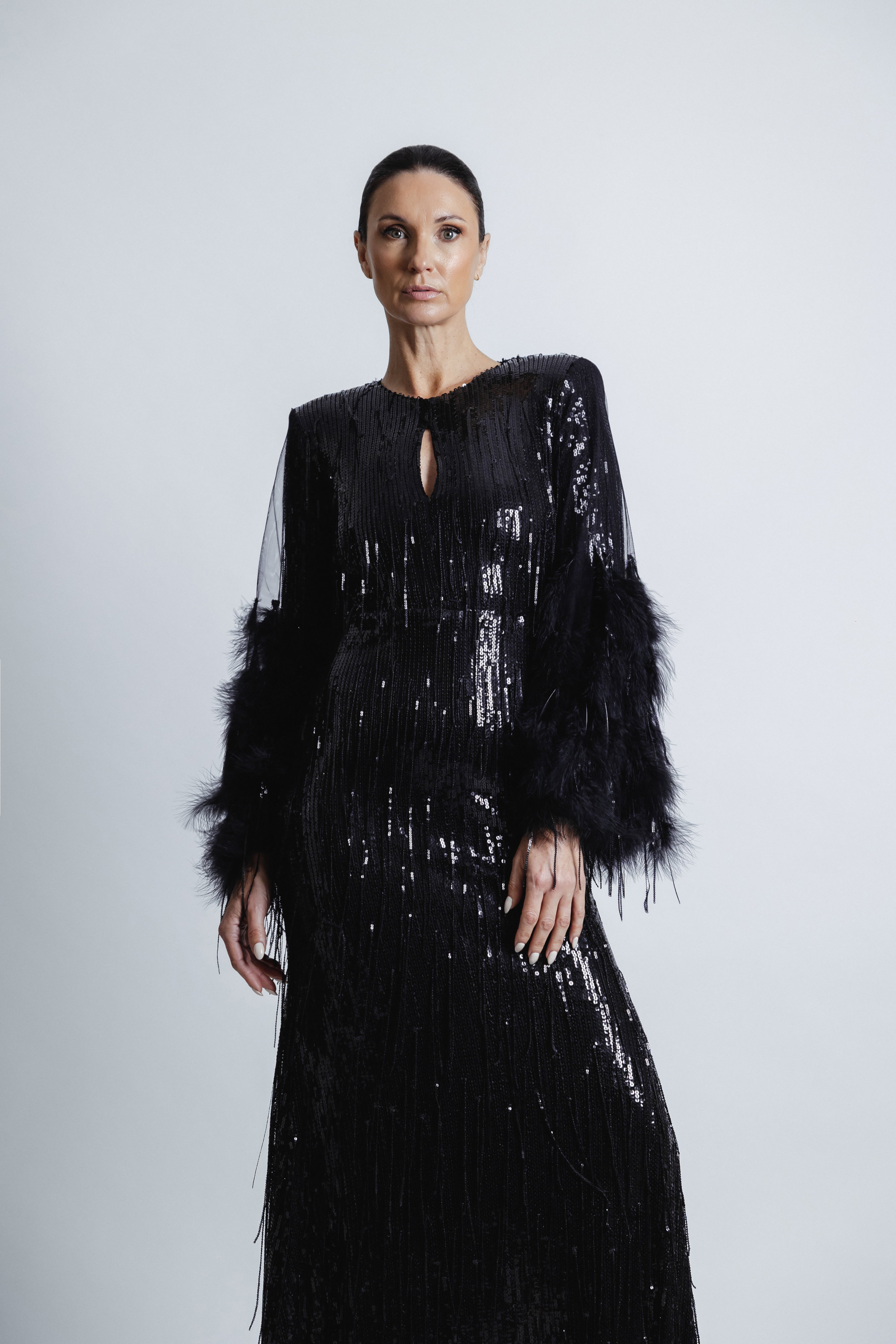 FEATHERED BLACK SEQUIN GOWN