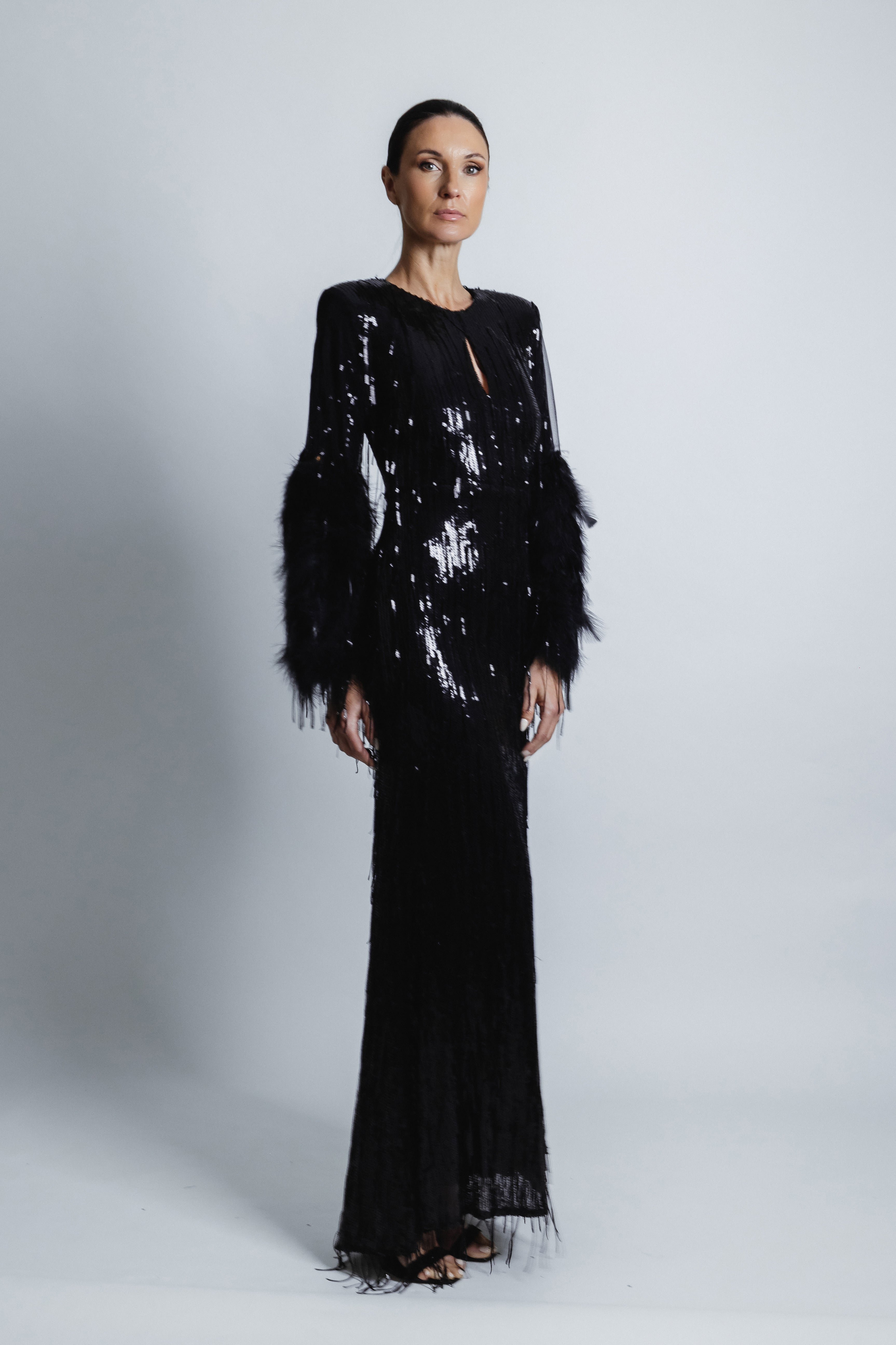 FEATHERED BLACK SEQUIN GOWN